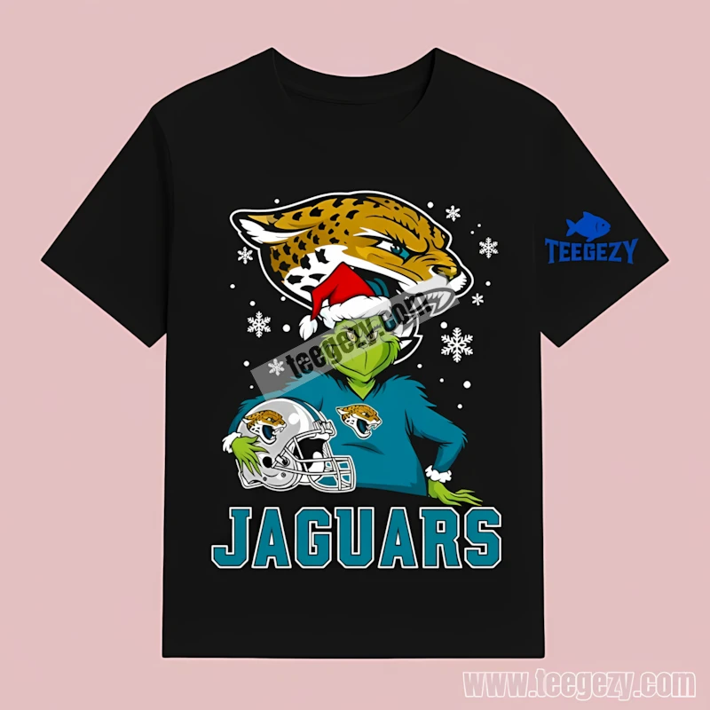 Jacksonville Jaguars Grinch Holding Helmet Snowy Cotton T-Shirt Jacksonville Jaguars Grinch Holding Helmet Snowy Cotton T-Shirt