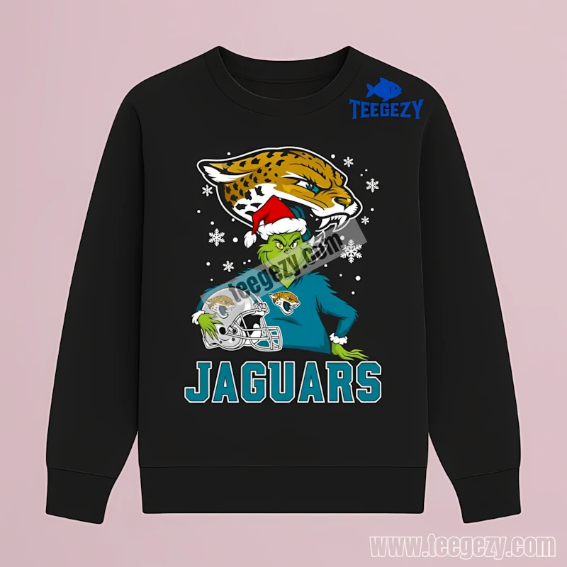 Jacksonville Jaguars Grinch Holding Helmet Snowy Cotton Long Sleeve Jacksonville Jaguars Grinch Holding Helmet Snowy Cotton Long Sleeve